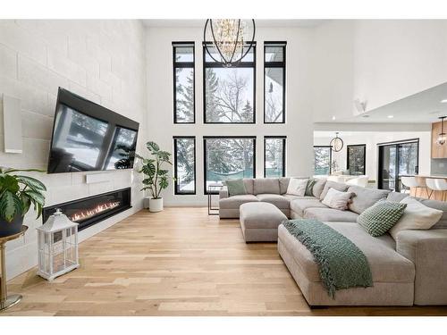 931 Shawnee Drive Sw, Calgary, AB - Indoor Photo Showing Living Room With Fireplace
