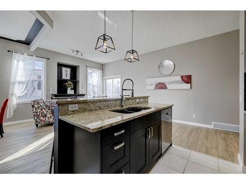 67 Prestwick Gardens Se, Calgary, AB - Indoor Photo Showing Kitchen With Double Sink