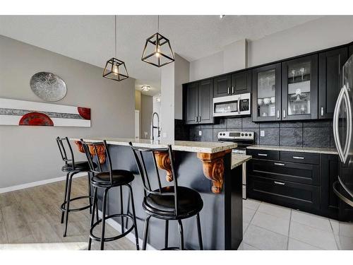 67 Prestwick Gardens Se, Calgary, AB - Indoor Photo Showing Kitchen With Upgraded Kitchen