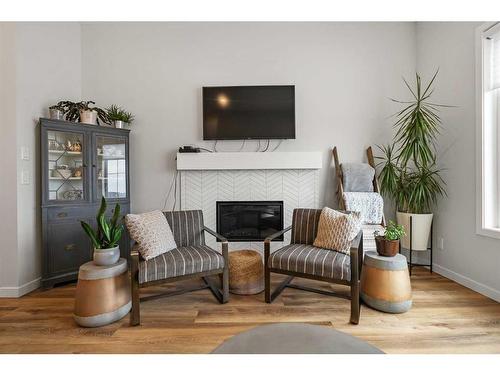 647 Marine Drive Se, Calgary, AB - Indoor Photo Showing Living Room With Fireplace