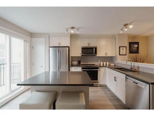 623 Cranbrook Walk Se, Calgary, AB - Indoor Photo Showing Kitchen With Stainless Steel Kitchen With Double Sink