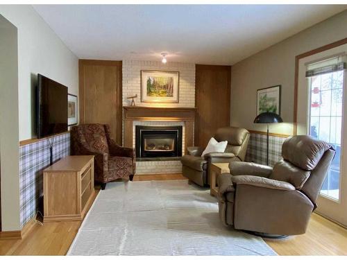 6011 Dalcastle Crescent Nw, Calgary, AB - Indoor Photo Showing Living Room With Fireplace
