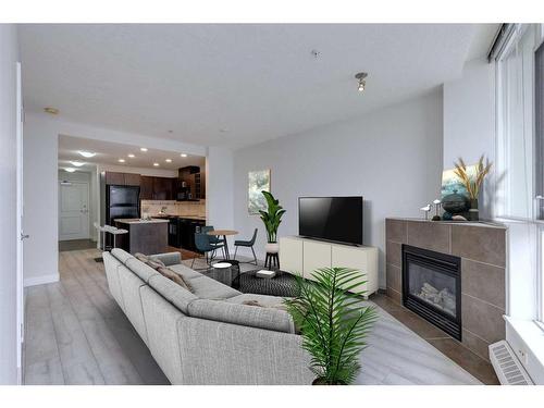 2303-77 Spruce Place Sw, Calgary, AB - Indoor Photo Showing Living Room With Fireplace