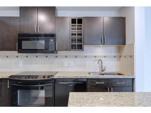 2303-77 Spruce Place Sw, Calgary, AB - Indoor Photo Showing Kitchen With Double Sink With Upgraded Kitchen