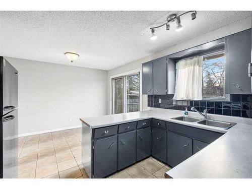 1515 43 Street Se, Calgary, AB - Indoor Photo Showing Kitchen With Double Sink