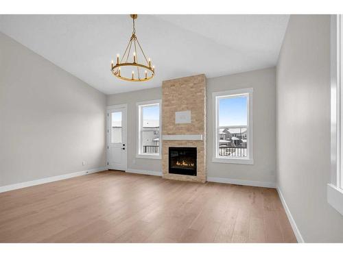 129 South Shore View, Chestermere, AB - Indoor Photo Showing Living Room With Fireplace