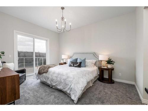 443 Rivercrest View, Cochrane, AB - Indoor Photo Showing Bedroom