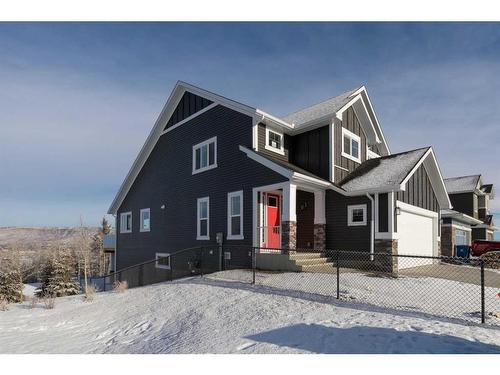 443 Rivercrest View, Cochrane, AB - Outdoor With Facade