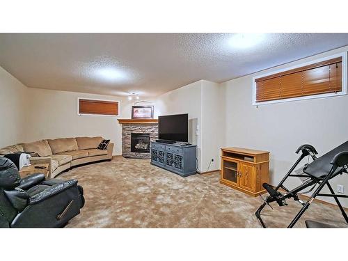 39 Panatella Crescent Nw, Calgary, AB - Indoor Photo Showing Other Room With Fireplace