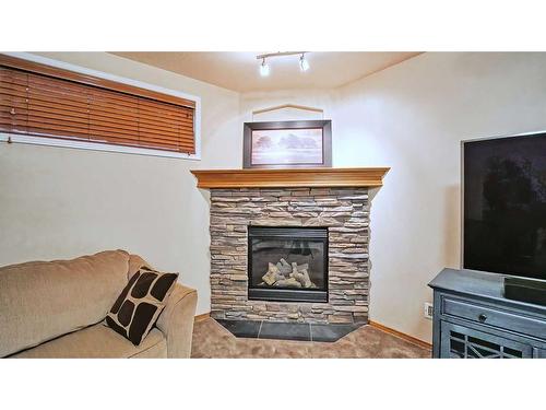39 Panatella Crescent Nw, Calgary, AB - Indoor Photo Showing Living Room With Fireplace