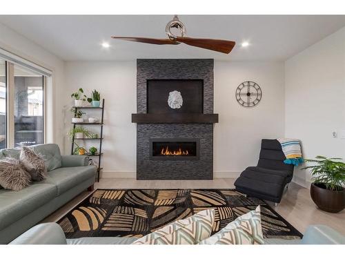 13 Walden Park Se, Calgary, AB - Indoor Photo Showing Living Room With Fireplace