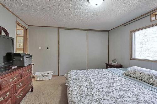 33122 Range Road 50, Sundre, AB - Indoor Photo Showing Bedroom