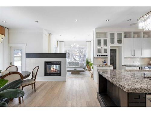 20 Spring Valley Way Sw, Calgary, AB - Indoor Photo Showing Kitchen With Fireplace With Upgraded Kitchen