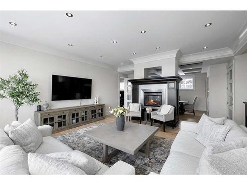 20 Spring Valley Way Sw, Calgary, AB - Indoor Photo Showing Living Room With Fireplace