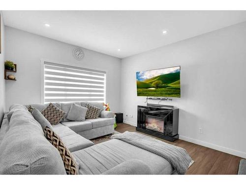 79 Homestead Park Ne, Calgary, AB - Indoor Photo Showing Living Room With Fireplace