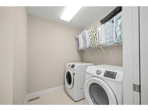 60 Evansfield Way Nw, Calgary, AB - Indoor Photo Showing Laundry Room