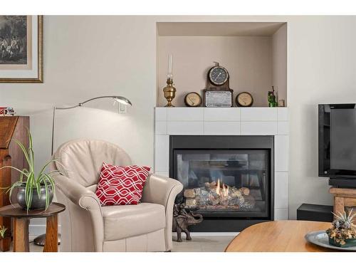 615 Pioneer Drive, Irricana, AB - Indoor Photo Showing Living Room With Fireplace