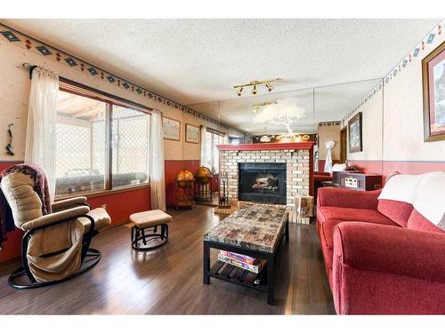 262 Shawnessy Drive Sw, Calgary, AB - Indoor Photo Showing Living Room With Fireplace