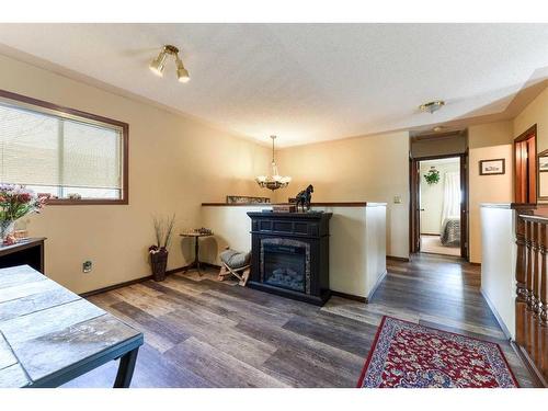 262 Shawnessy Drive Sw, Calgary, AB - Indoor Photo Showing Living Room With Fireplace