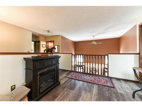 262 Shawnessy Drive Sw, Calgary, AB - Indoor Photo Showing Other Room With Fireplace
