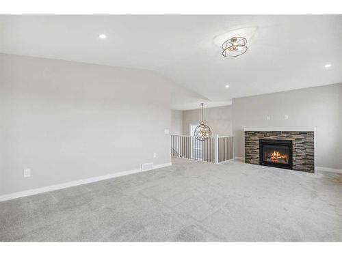 1347 Scarlett Ranch Boulevard, Carstairs, AB - Indoor With Fireplace