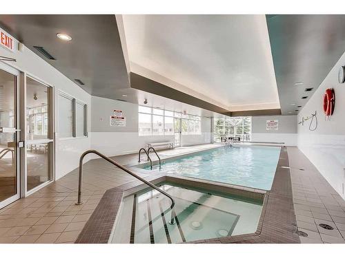 2422-3400 Edenwold Heights Nw, Calgary, AB - Indoor Photo Showing Other Room With In Ground Pool