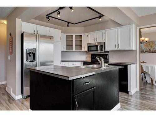 44 Woodfern Way Sw, Calgary, AB - Indoor Photo Showing Kitchen With Double Sink
