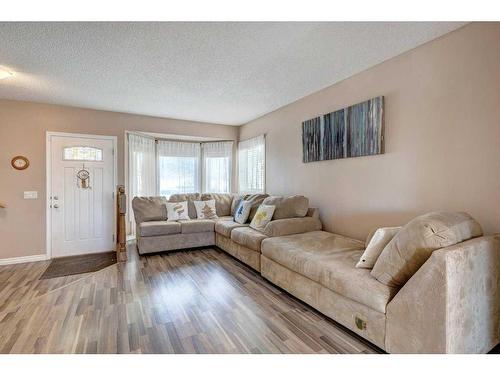 44 Woodfern Way Sw, Calgary, AB - Indoor Photo Showing Living Room