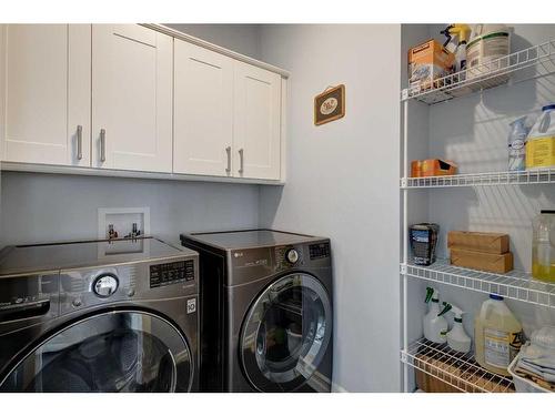 104 1 Avenue Se, Langdon, AB - Indoor Photo Showing Laundry Room