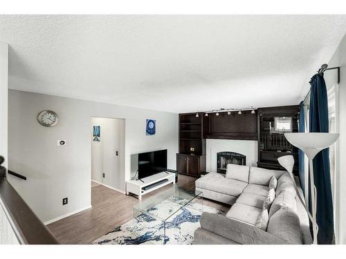 86 Riverside Close Se, Calgary, AB - Indoor Photo Showing Living Room With Fireplace