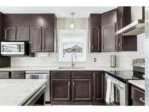 86 Riverside Close Se, Calgary, AB - Indoor Photo Showing Kitchen With Double Sink