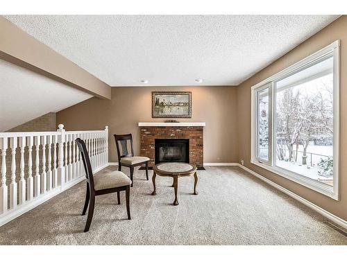 123 Canterville Drive Sw, Calgary, AB - Indoor With Fireplace