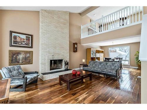 123 Canterville Drive Sw, Calgary, AB - Indoor Photo Showing Living Room With Fireplace