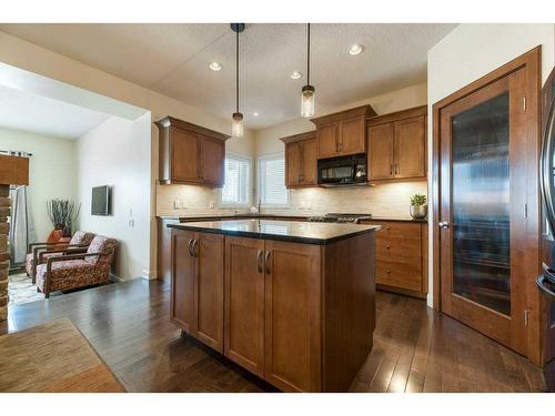 62 Aspen Hills Way Sw, Calgary, AB - Indoor Photo Showing Kitchen With Fireplace