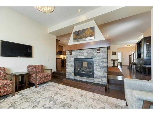 62 Aspen Hills Way Sw, Calgary, AB - Indoor Photo Showing Living Room With Fireplace