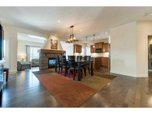 62 Aspen Hills Way Sw, Calgary, AB - Indoor With Fireplace