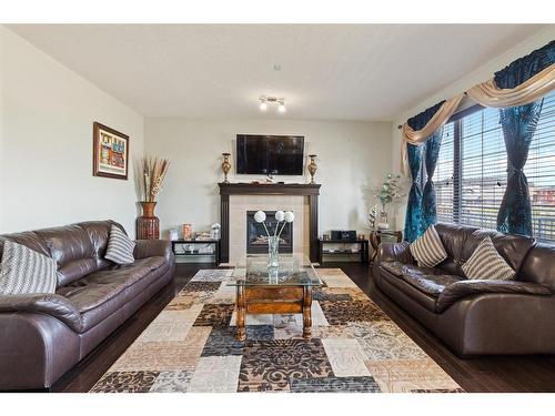 381 Saddlemont Boulevard Ne, Calgary, AB - Indoor Photo Showing Living Room With Fireplace