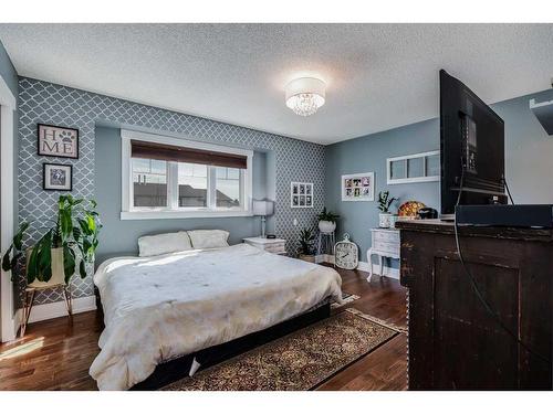 62 Downey Road, Okotoks, AB - Indoor Photo Showing Bedroom