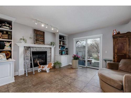 62 Downey Road, Okotoks, AB - Indoor Photo Showing Other Room With Fireplace