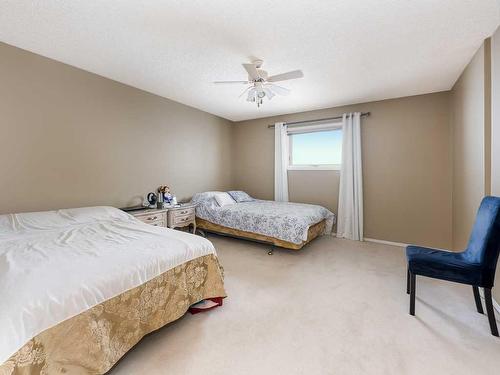 208 Millbank Road Sw, Calgary, AB - Indoor Photo Showing Bedroom