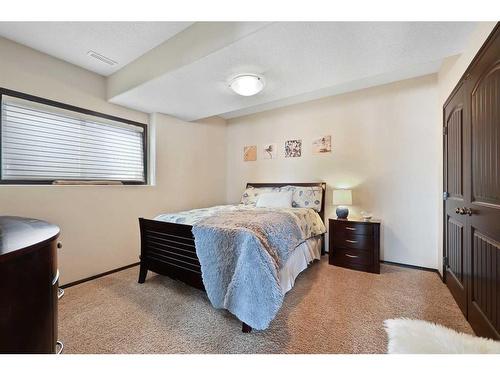 627 Boulder Creek Drive Se, Langdon, AB - Indoor Photo Showing Bedroom