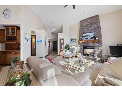 627 Boulder Creek Drive Se, Langdon, AB - Indoor Photo Showing Living Room With Fireplace