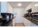 405-9930 Bonaventure Drive Se, Calgary, AB  - Indoor Photo Showing Kitchen With Double Sink 