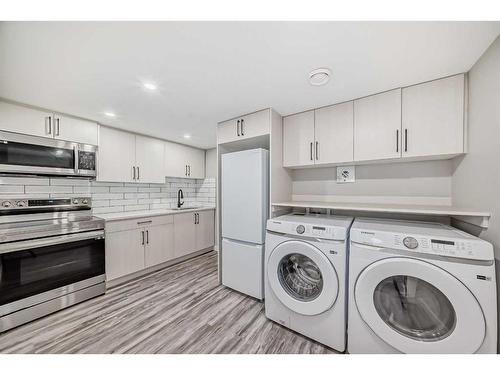 153 Carrington Close Nw, Calgary, AB - Indoor Photo Showing Laundry Room