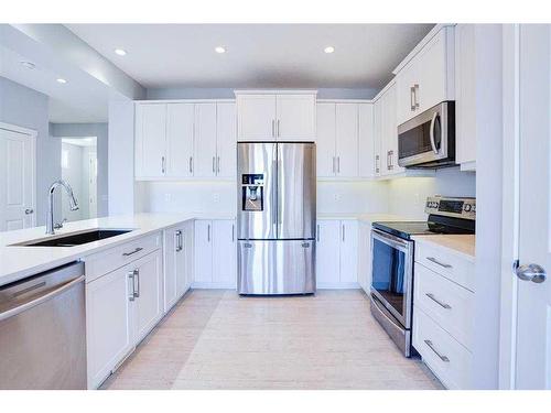202 Reunion Green Nw, Airdrie, AB - Indoor Photo Showing Kitchen With Upgraded Kitchen