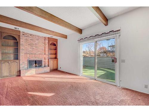 36 Thames Place Nw, Calgary, AB - Indoor Photo Showing Other Room With Fireplace