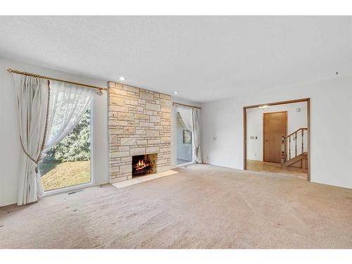 36 Thames Place Nw, Calgary, AB - Indoor With Fireplace