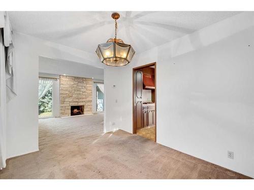 36 Thames Place Nw, Calgary, AB - Indoor With Fireplace