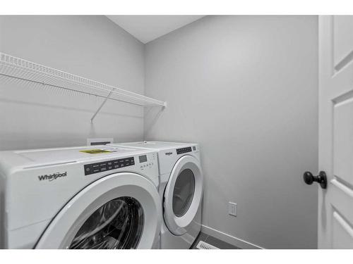 342 Chelsea Hollow, Chestermere, AB - Indoor Photo Showing Laundry Room