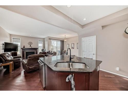 516 Panatella Square Nw, Calgary, AB - Indoor With Fireplace